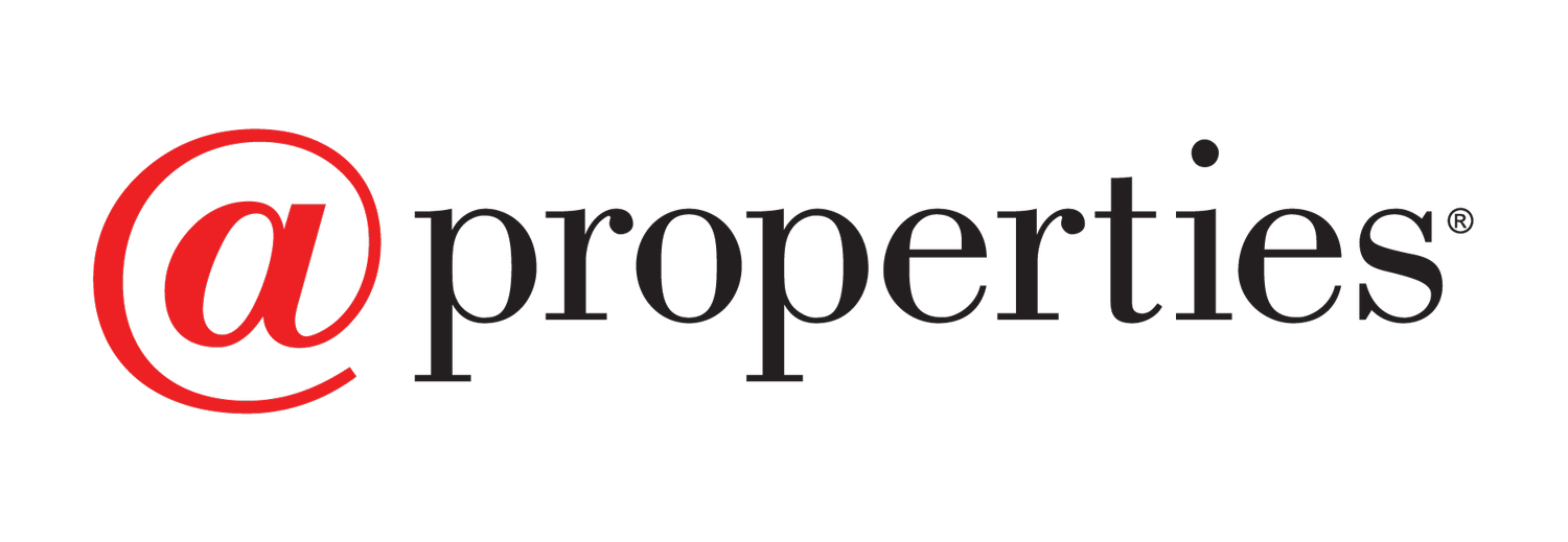 Logo with red @ symbol and black text '@properties'.