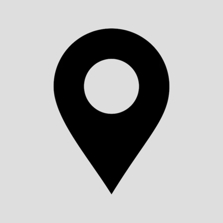 A black location pin icon on a gray background.
