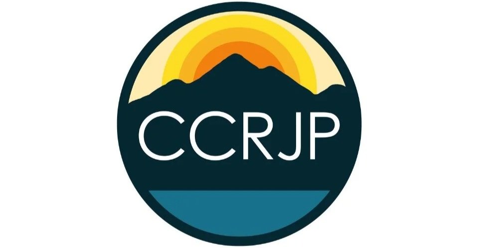 Logo with a mountain, sunset, and water, with the letters 'CCRJP' in the center.