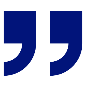 Two large blue quotation marks on a black background.