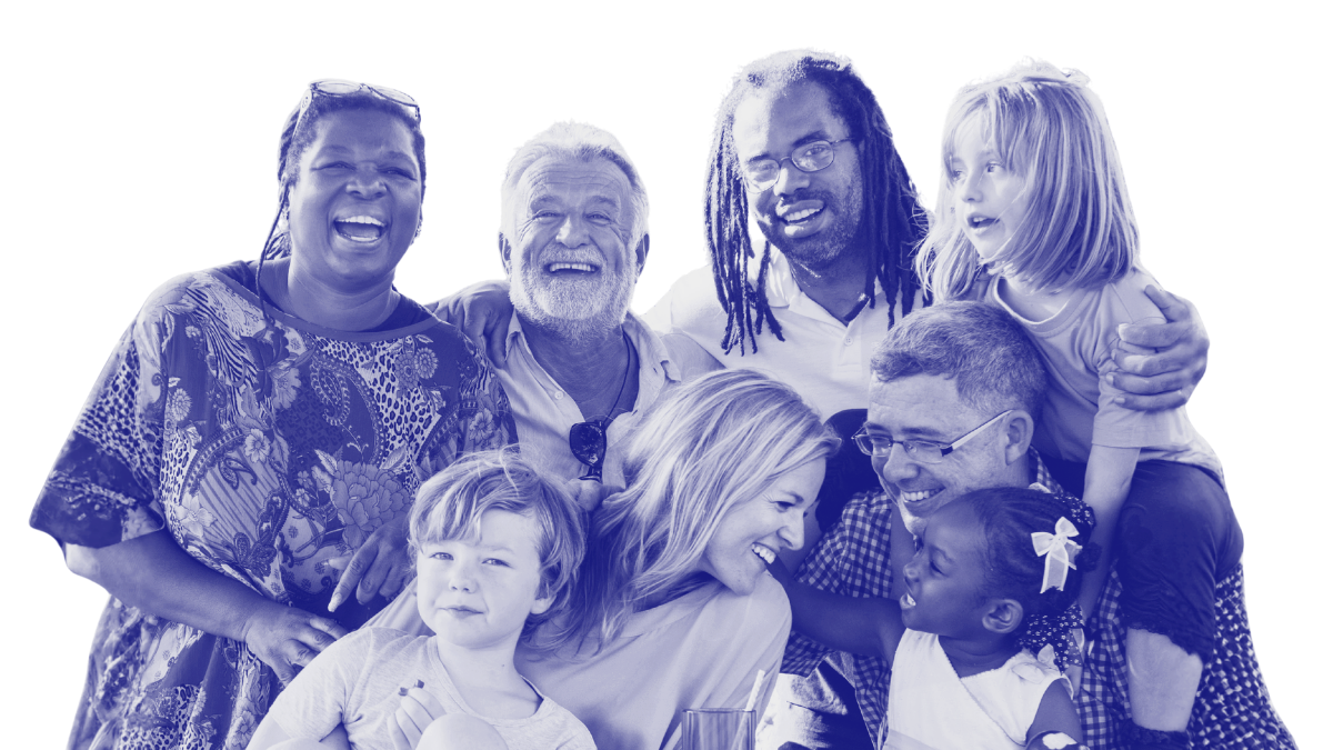 A group of seven people, including adults and children, smiling and celebrating together.