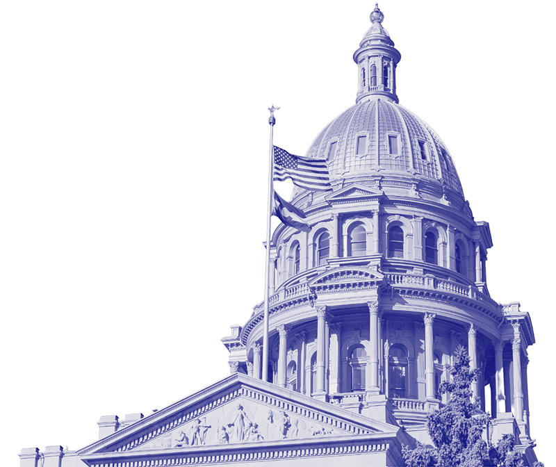 The image shows the dome and facade of a detailed government building, with an American flag flying in front.