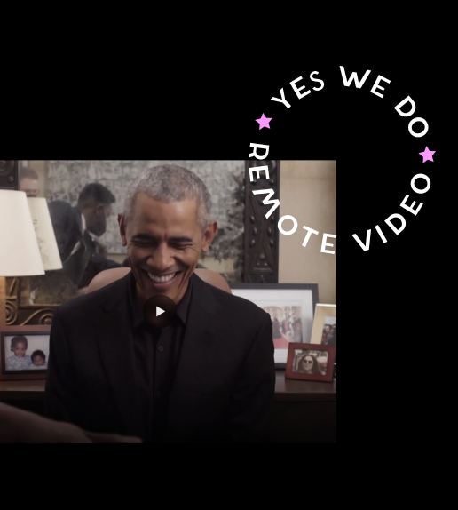 Smiling man in a black suit sitting at a table with framed photos behind him, with a circular overlay reading 'Yes We Do, Remove Video' in white text and purple stars.