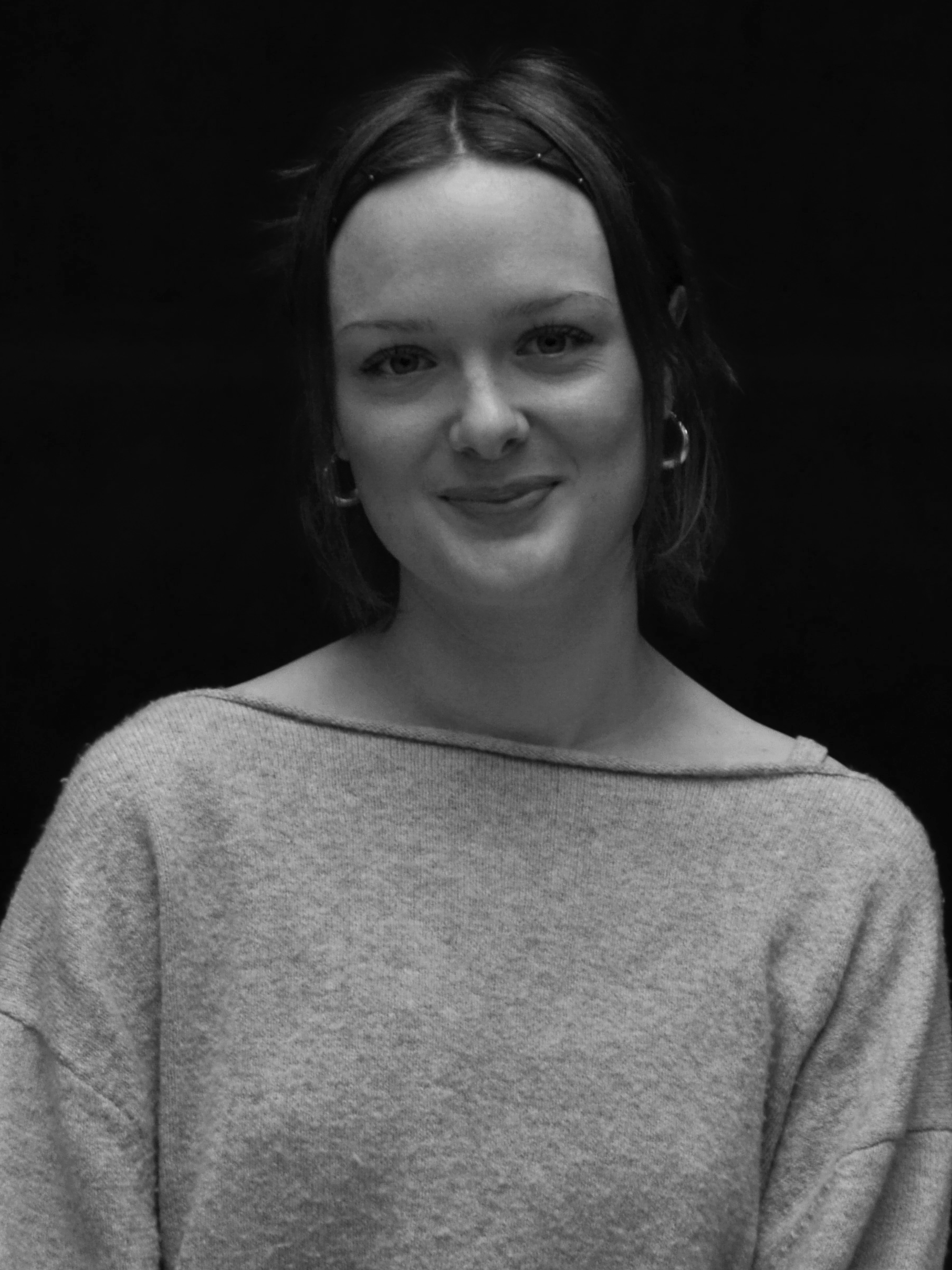 A black and white image of actor Grace Greer from the shoulders up