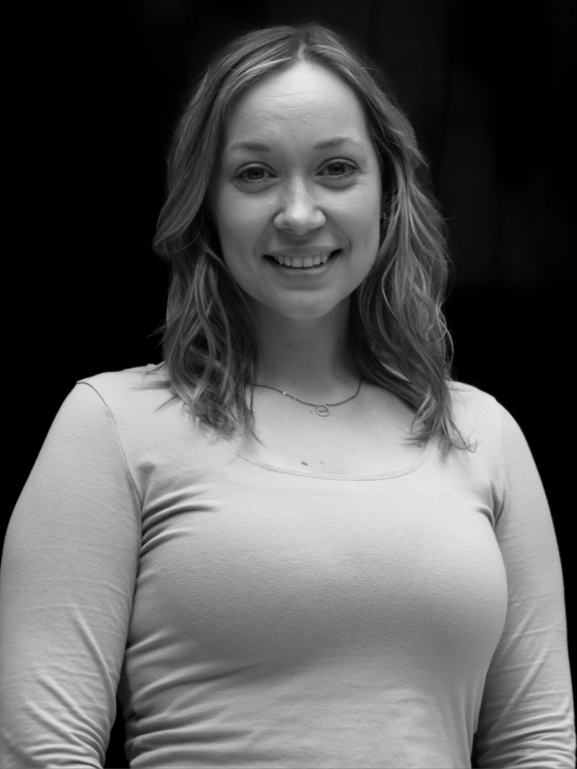 A black and white image of actor Merissa MacNeill from the shoulders up
