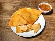 Plate with fried chips and a side of salsa