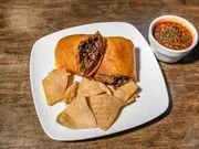Plate with fried spring rolls and a dipping sauce