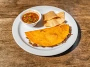 Plate with a large piece of fried fish, a small bowl of dipping sauce, and a few pieces of fried dough or bread.