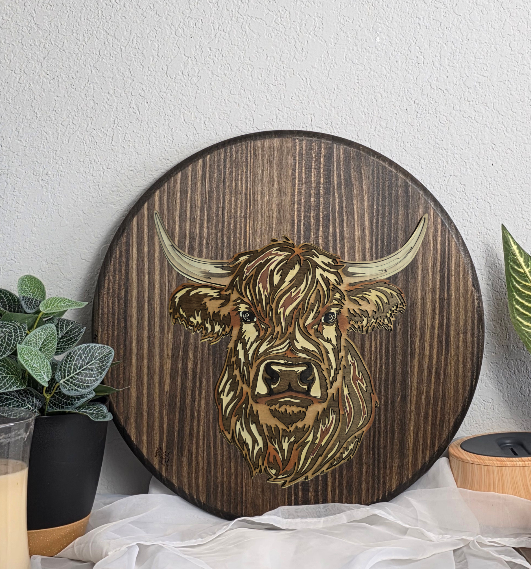 highland+cow+round+wood+sign+lifestyle+photo.png