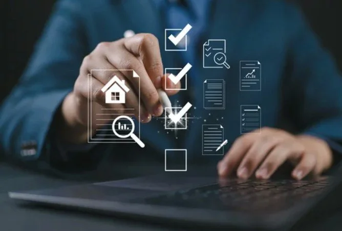 Person interacting with a tablet and digital icons related to real estate, goals, and data analysis.