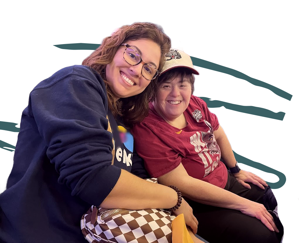 two women smiling while at a sporting event outing through Glenkirk