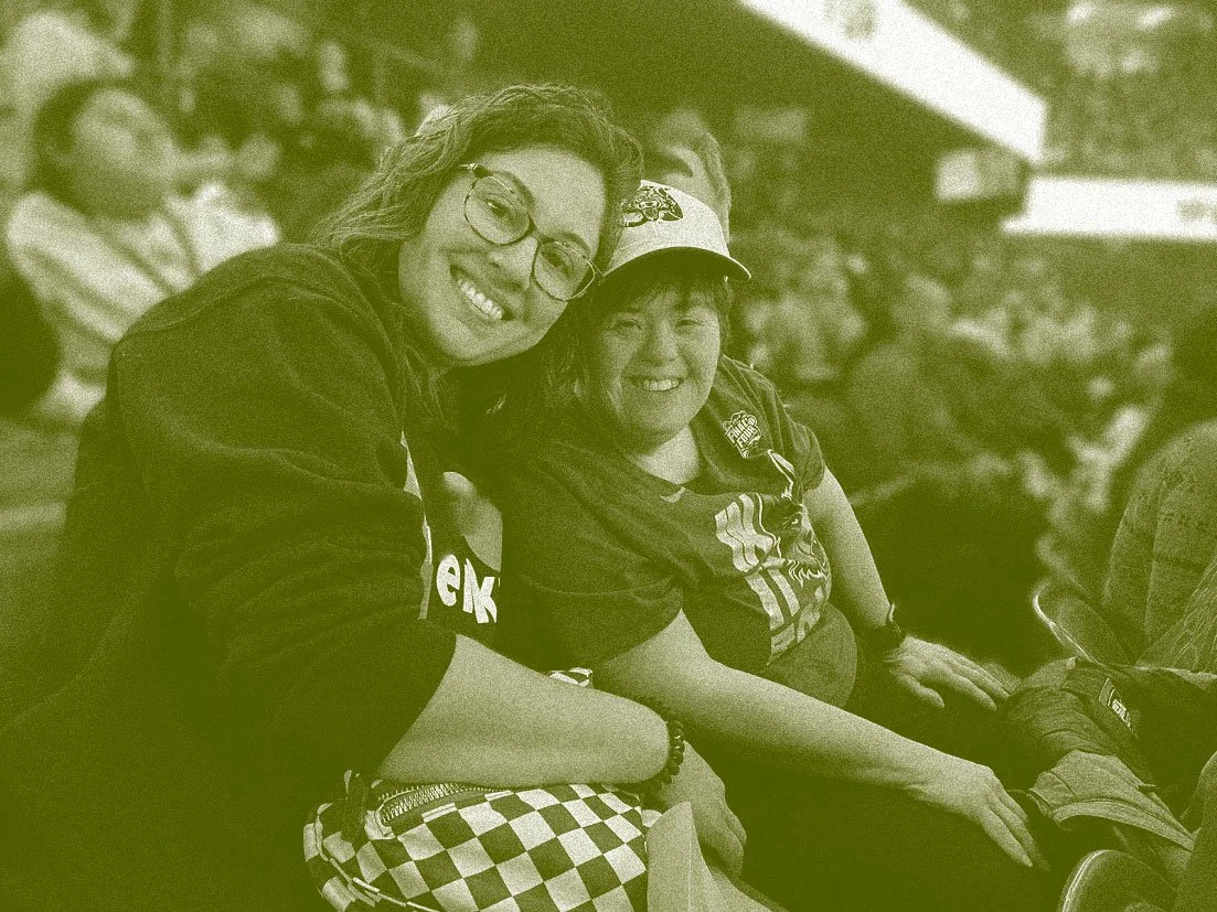 two women in the stands at a Glenkirk sports outing