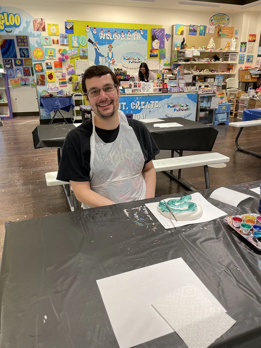 Man participating in art program at Glenkirk