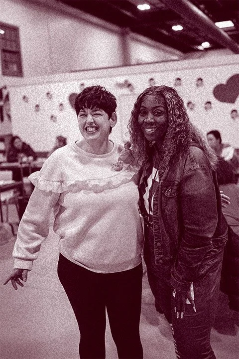 two women smiling together at Search360's program for adults with I/DD