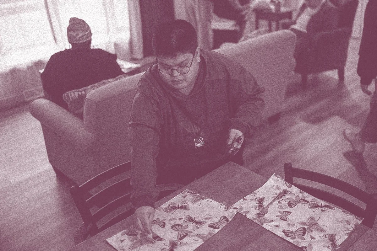woman setting table in Search360 community living for adults with I/DD