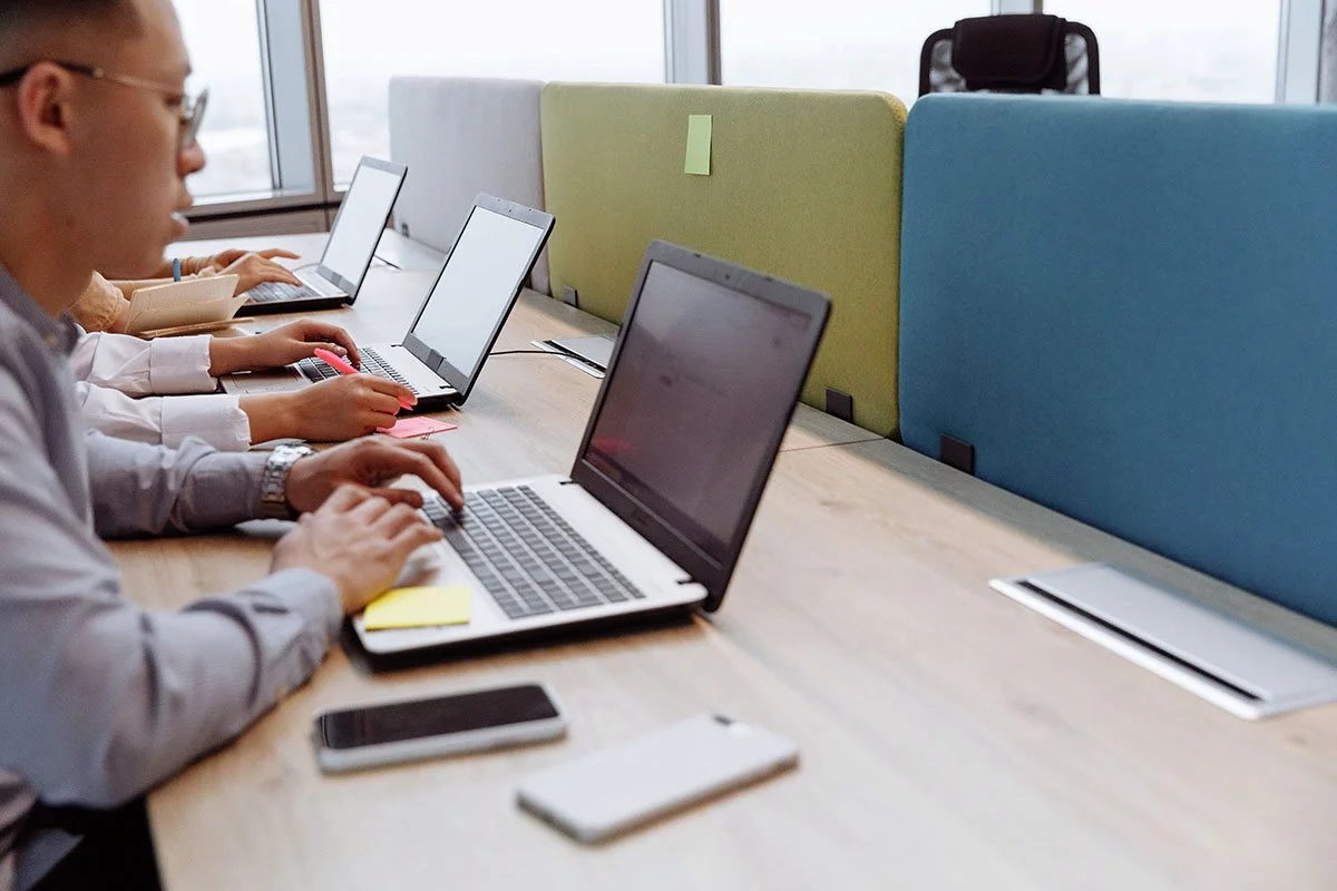 nonprofit team members working on computers IT systems