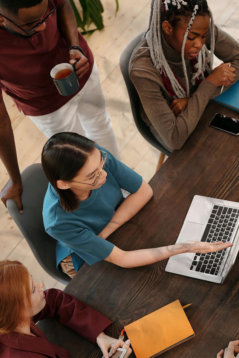 nonprofit shared back office services team collaborating at conference room table