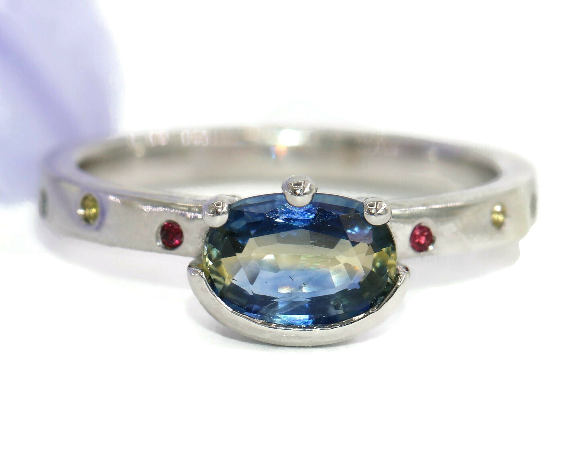 East West 1.2 ct Oval Natural Sapphire Cigar Ring with Scattered Flush Gemstones