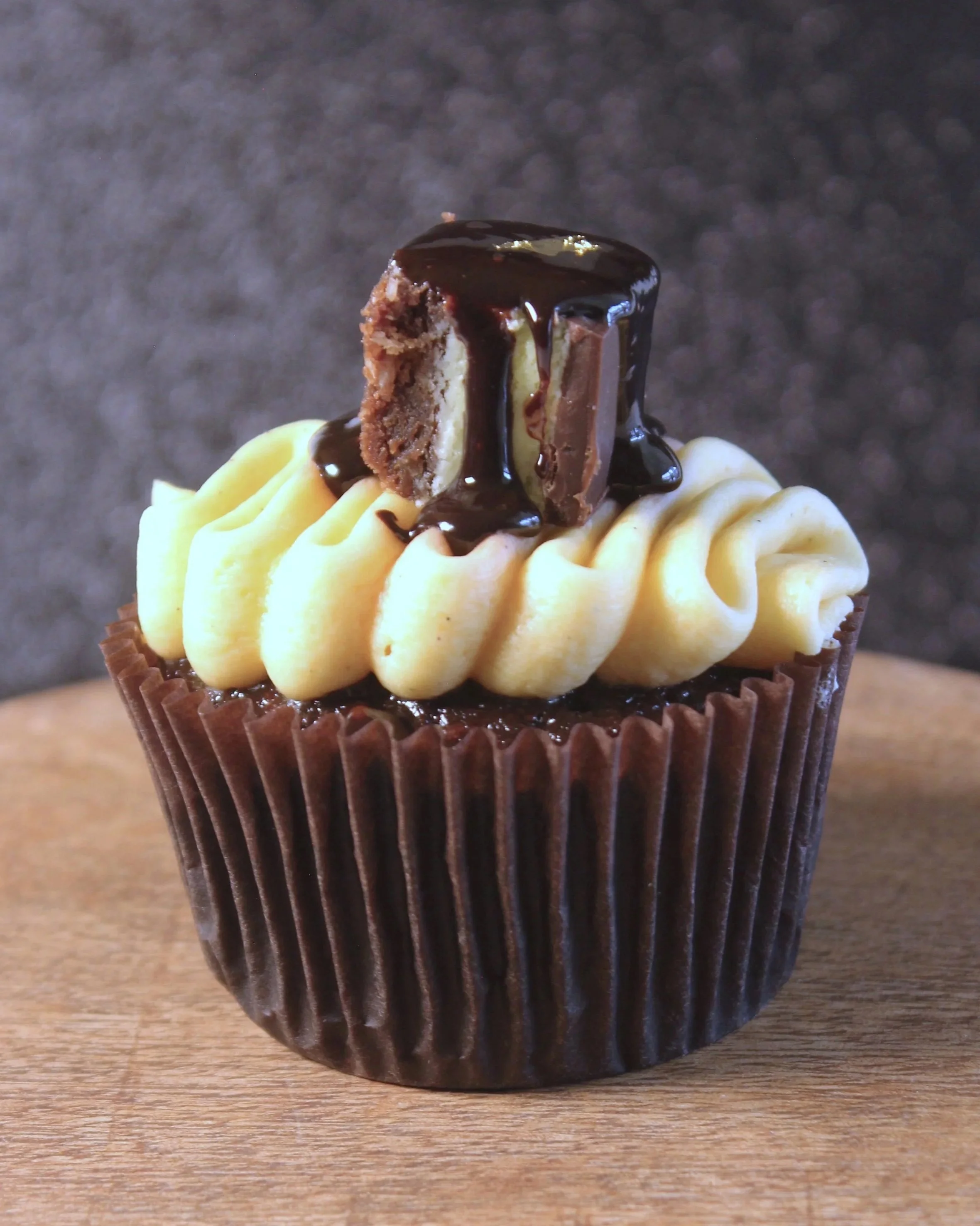 West Coast Witch: Rich chocolate-coconut cake topped with smooth vanilla custard cream and topped with a square of Nanaimo bar.