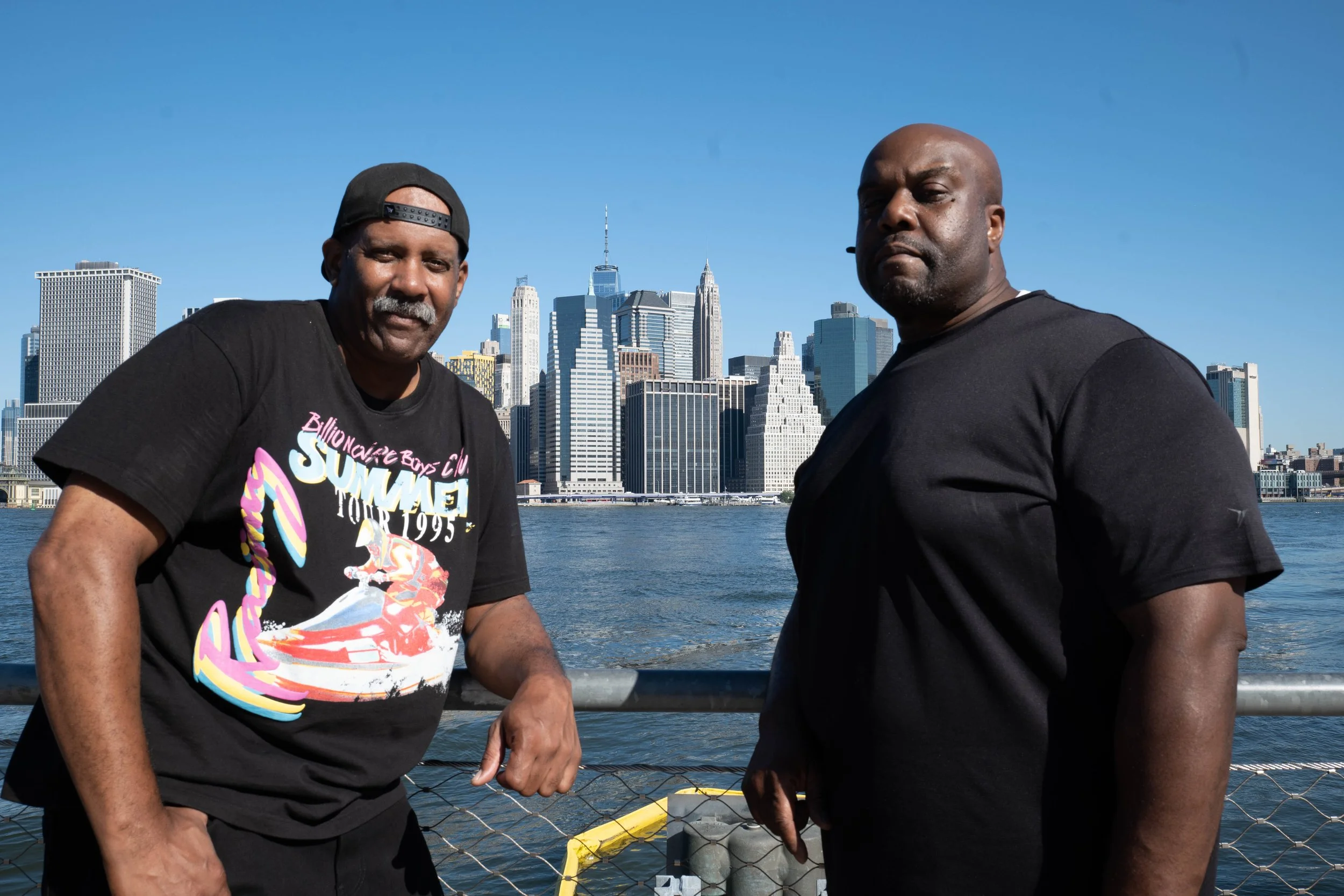 Lawrence and Herman from Those Guys Aerial LLC on the East River with Manhattan in the background.