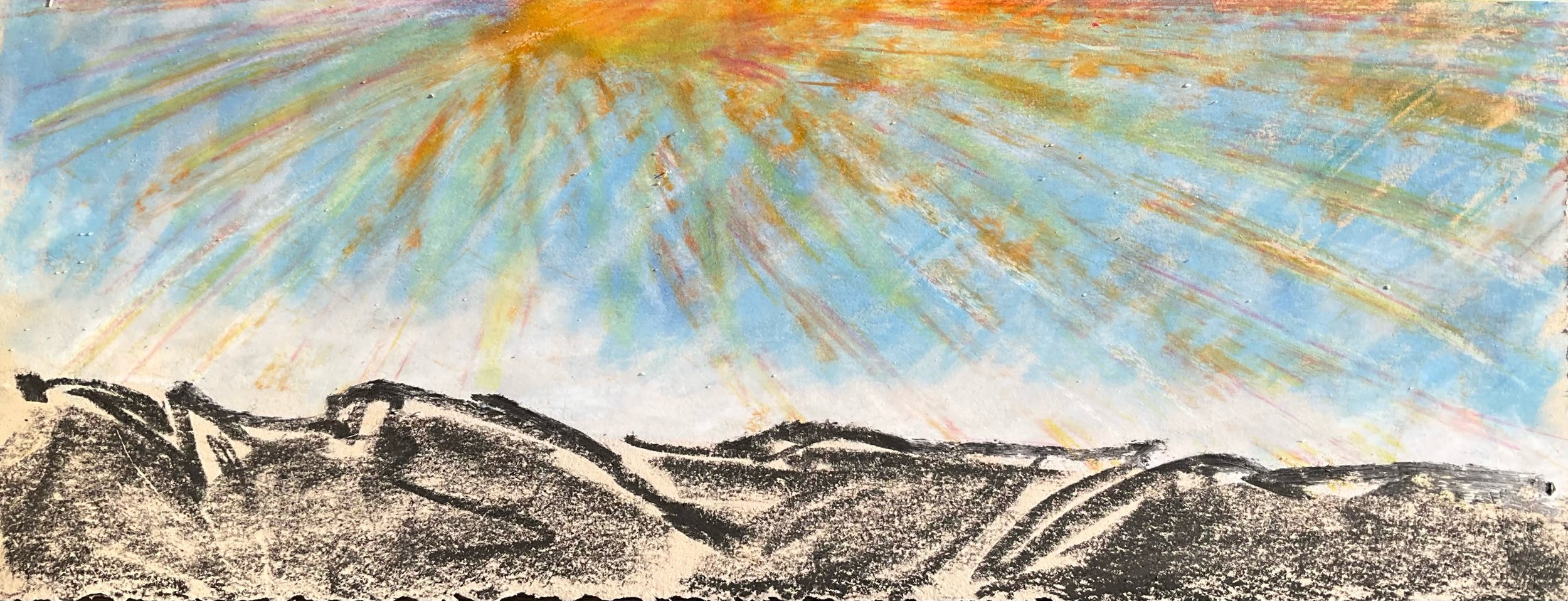 A colorful sky with rays of sunlight beaming down over rolling hills rendered in black and white.