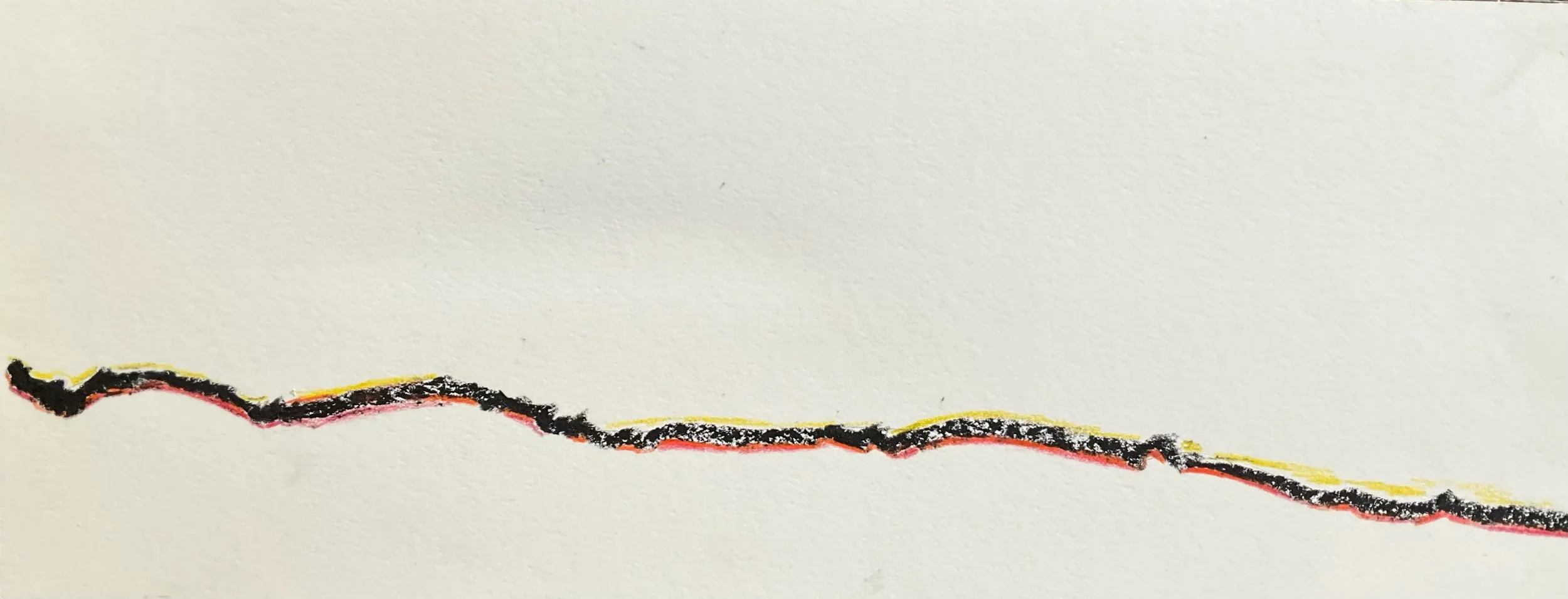 A close-up of a ripped or torn piece of paper with a black, pink, and yellow trace along the tear.