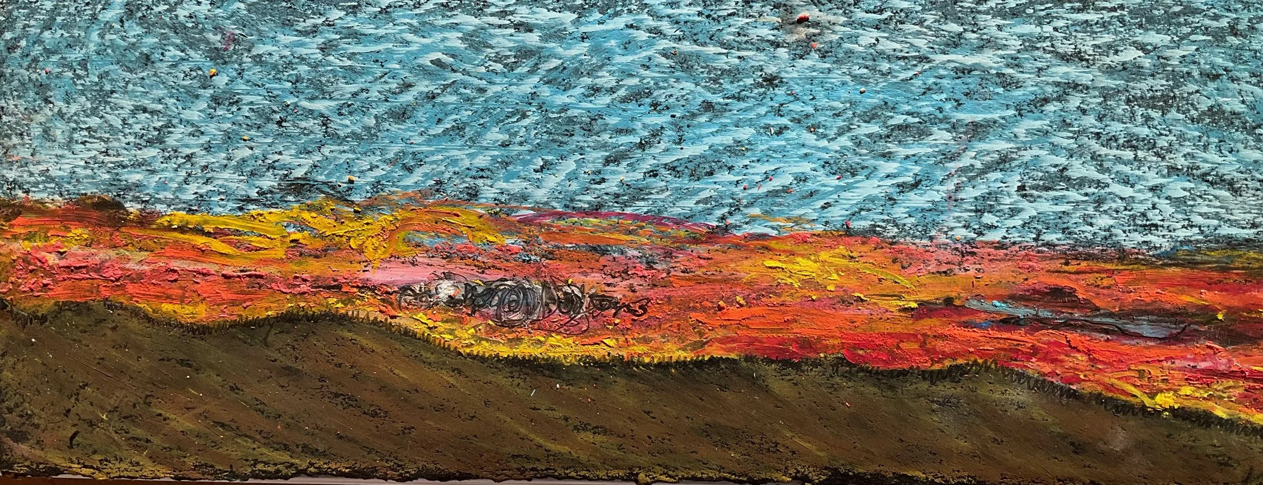 Close-up photo of an abstract painting featuring a blue sky, colorful ground with red, yellow, orange, and pink hues, and textured brushstrokes