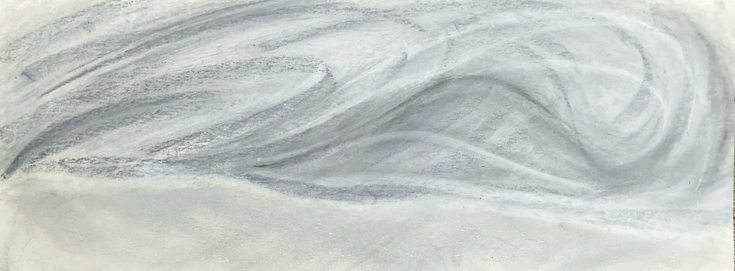 A close-up of a small, textured paper plane made from white paper with gray shading, resting on a white surface.