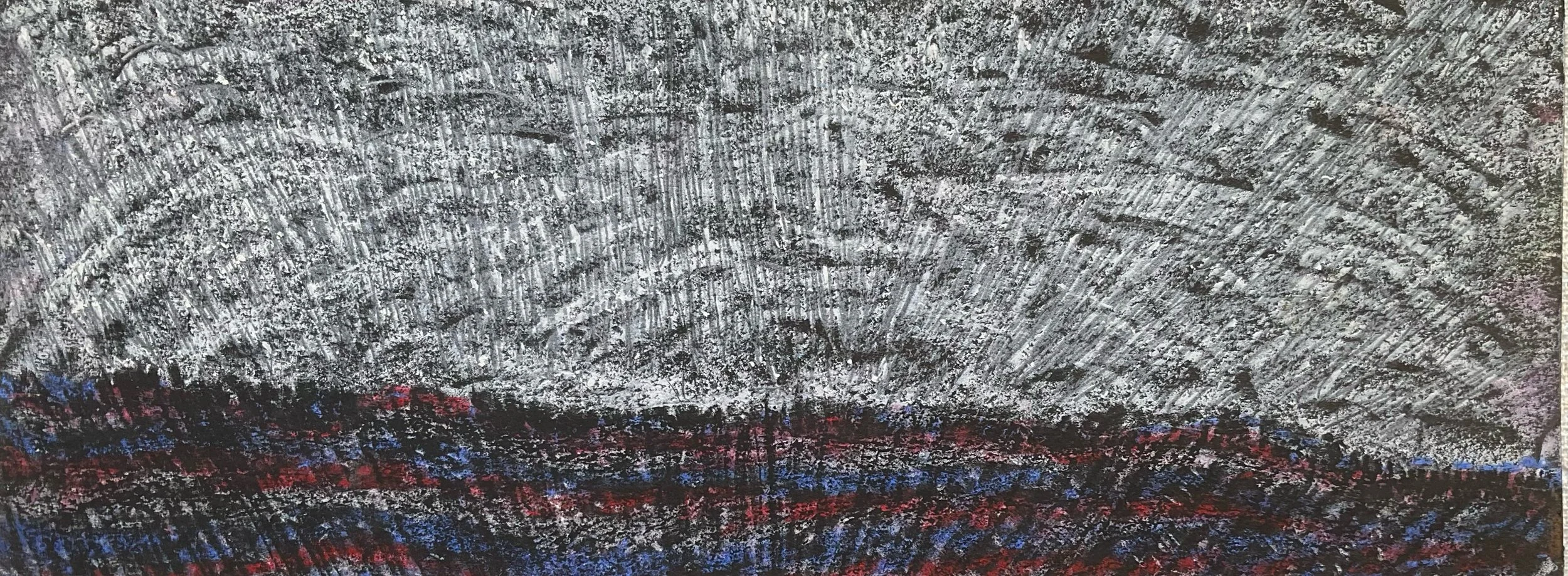 Close-up of a textured surface with silver, black, red, and blue colors, resembling an abstract artwork or chalk drawing.