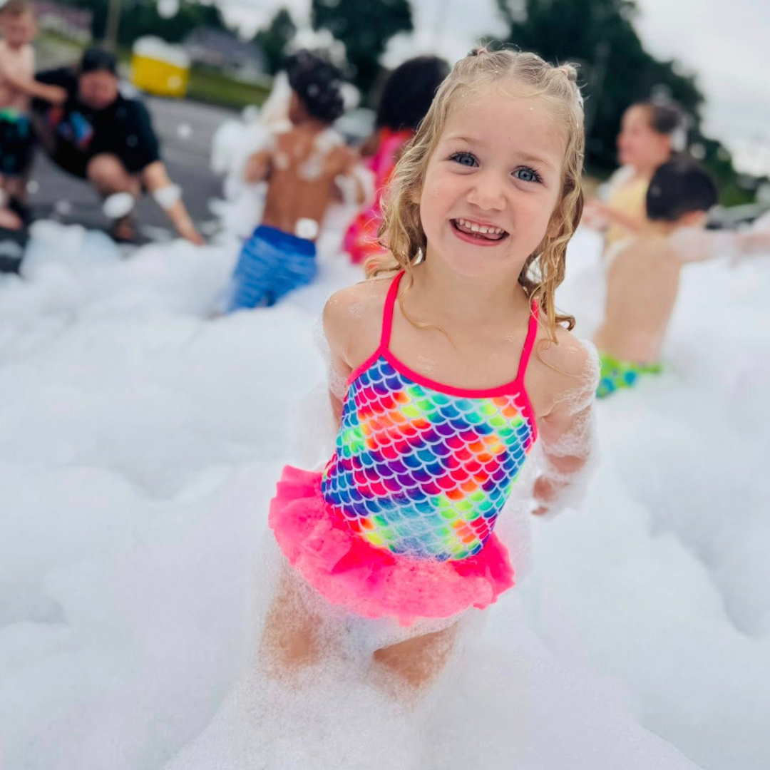 Little girl at a foam party