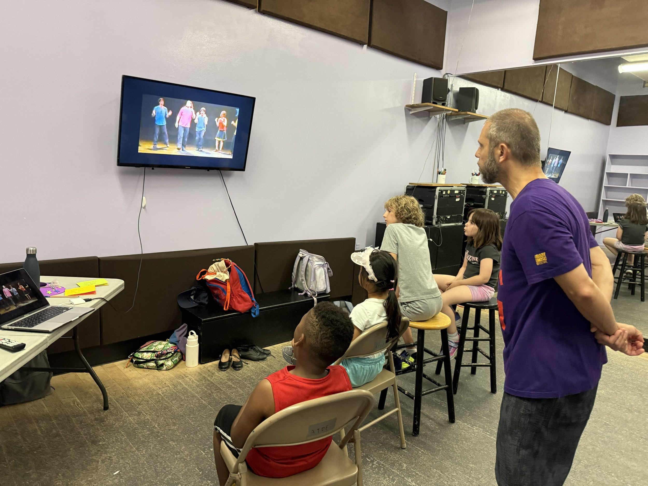Tap Camp kids watching a historical tap dance film
