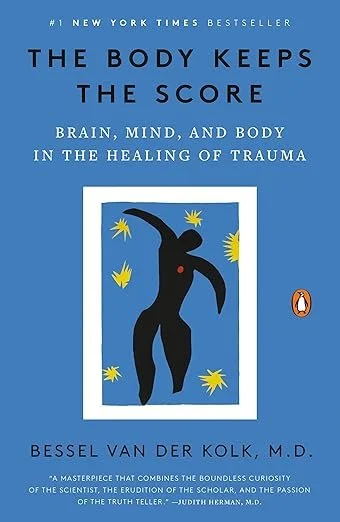 Book cover titled 'The Body Keeps the Score' with subtitle 'Brain, mind, and body in the healing of trauma' by Bessel Van Der Kolk, M.D. It has a blue background with an abstract black figure surrounded by yellow starburst shapes and the Penguin logo on the right side.