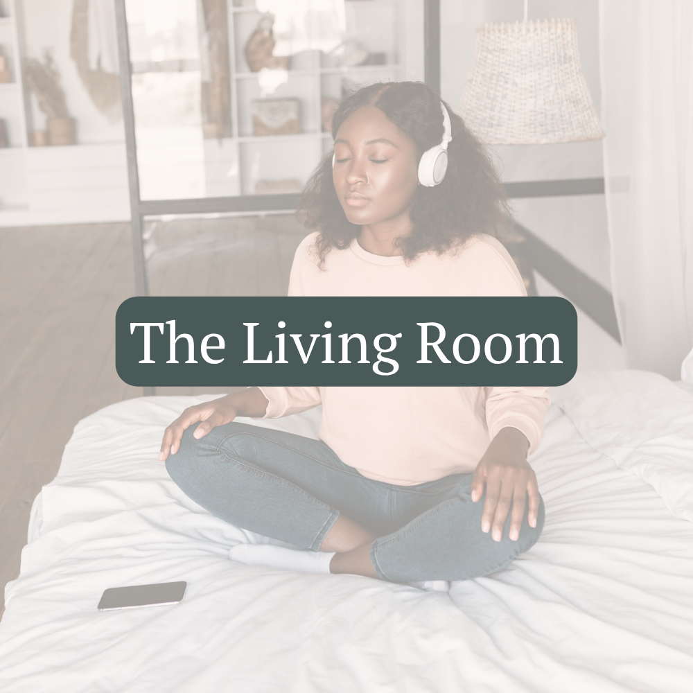 A woman wearing headphones sits comfortably on a bed during an online guided practice.