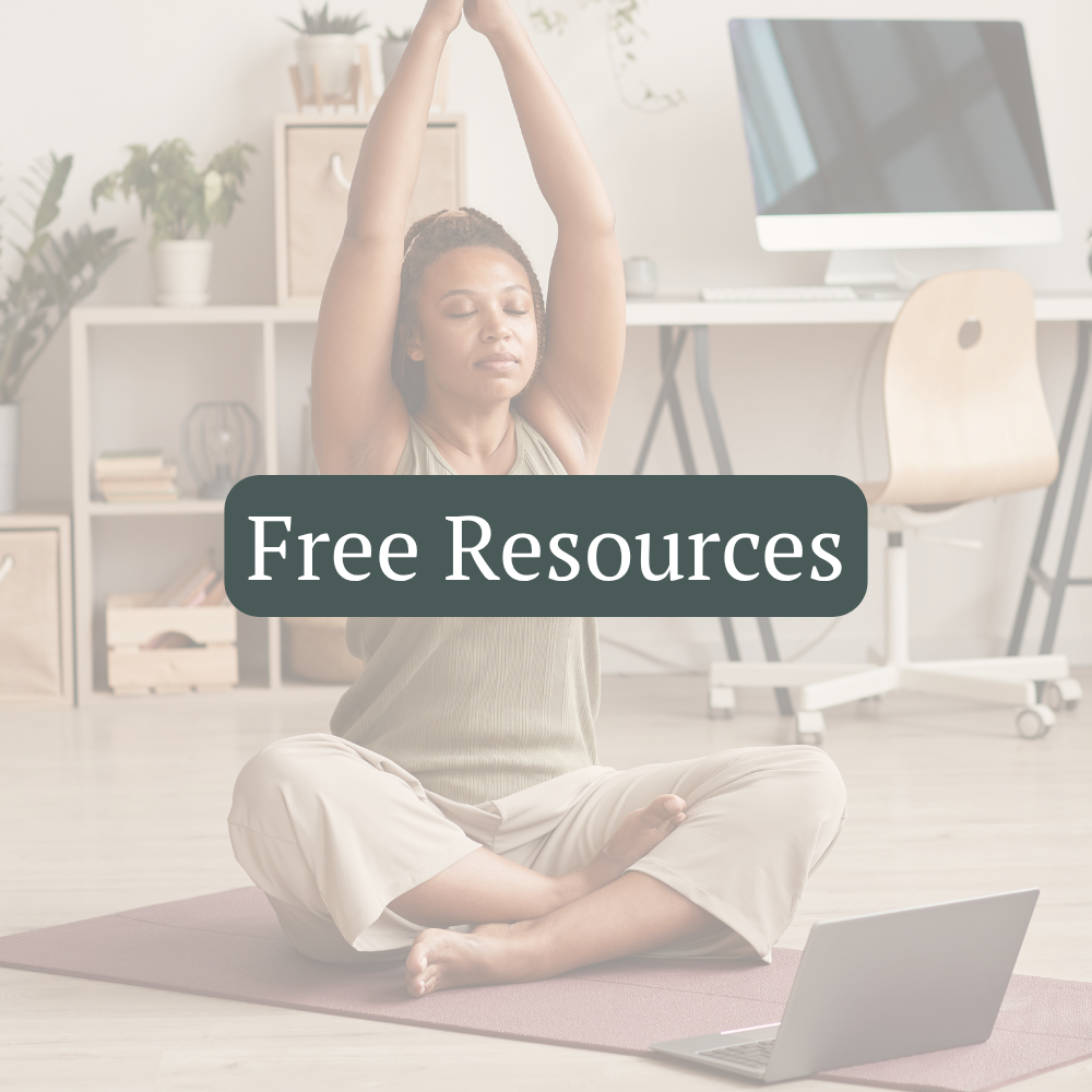 A woman follows an online yoga practice at home with her arms raised overhead.