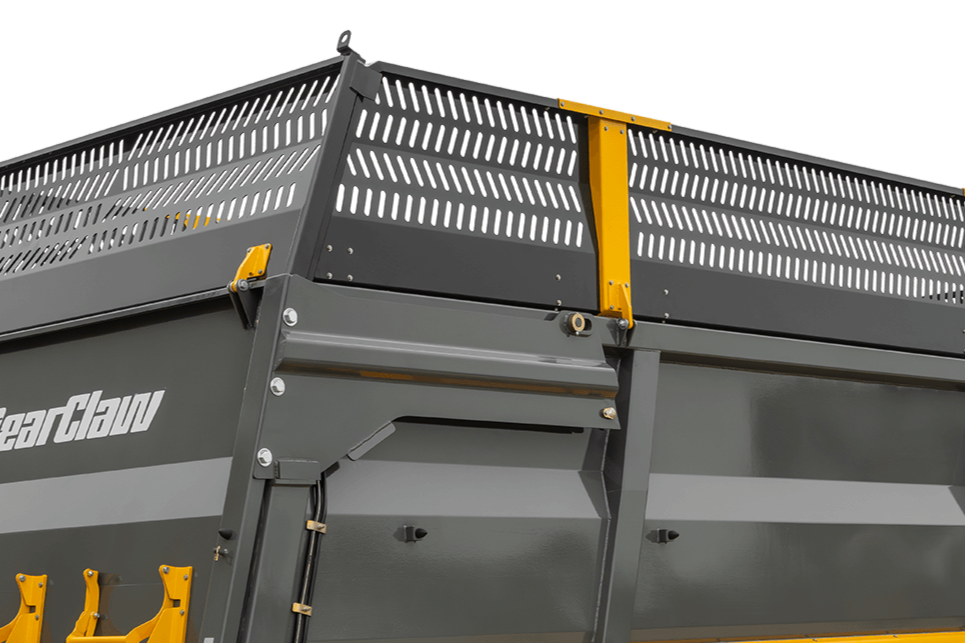 Close-up of a gray mechanical dumpster with yellow safety features.