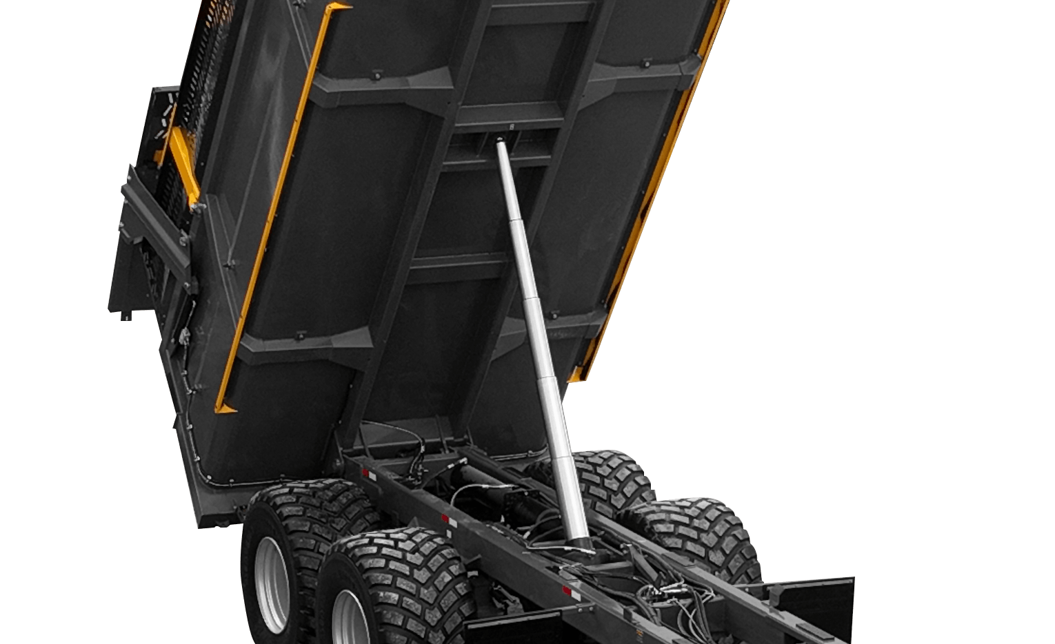 Close-up of the underside of a dump truck bed with hydraulic support, wheels, and mechanical components visible.
