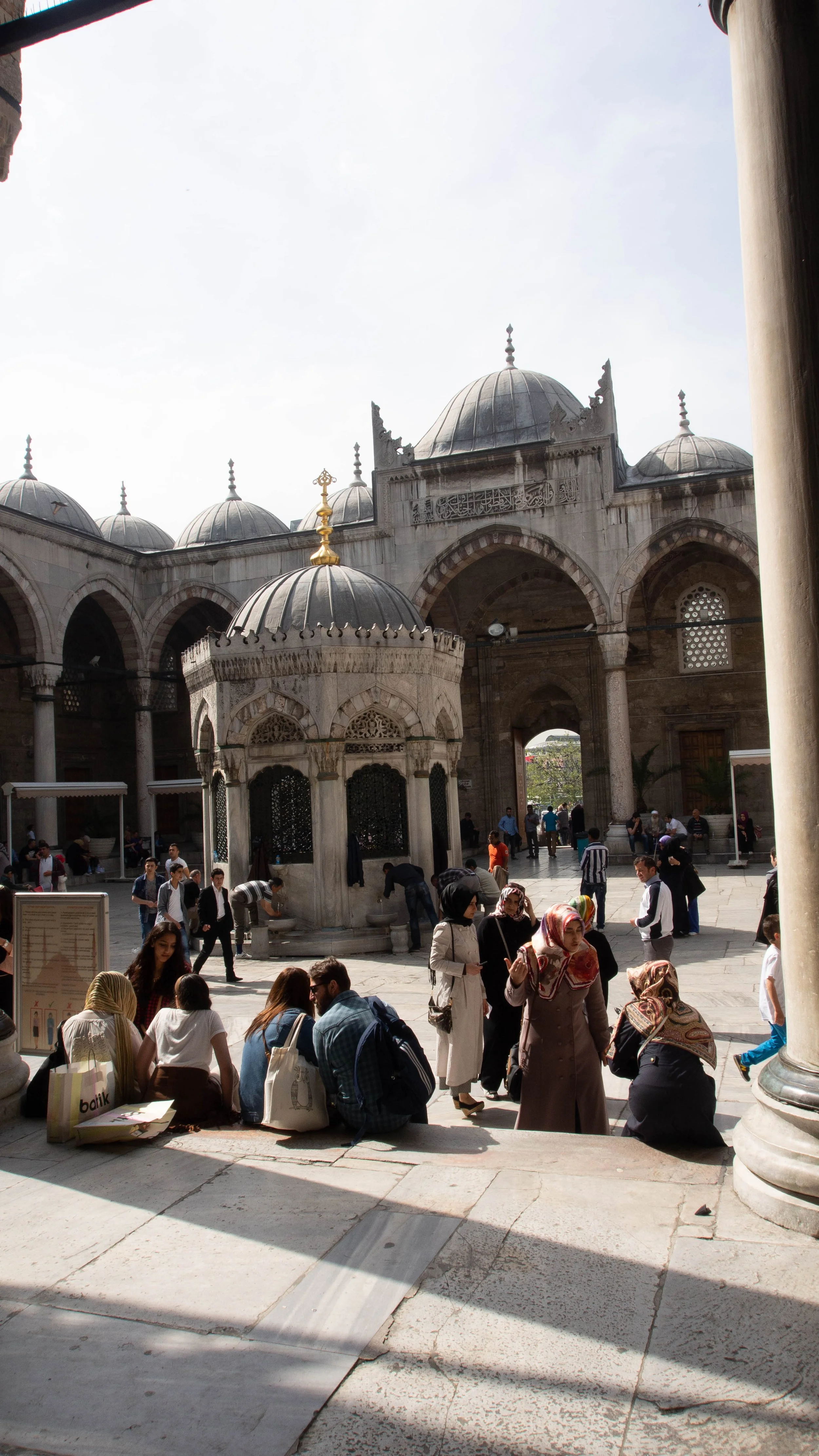People waiting to enter the mosque