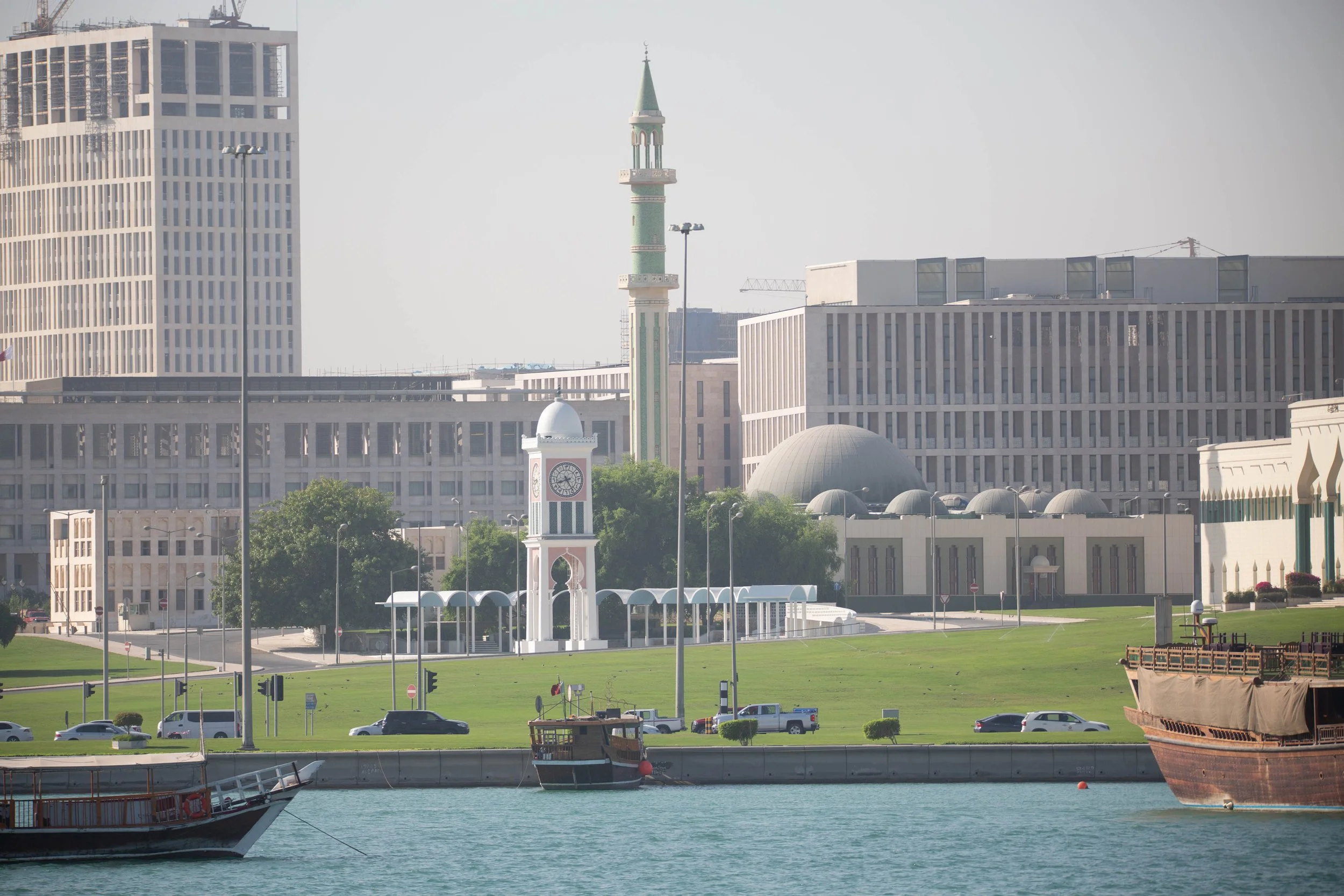 Doha Grand Mosque with the old port ships in the foreground and the modern Doha in the background