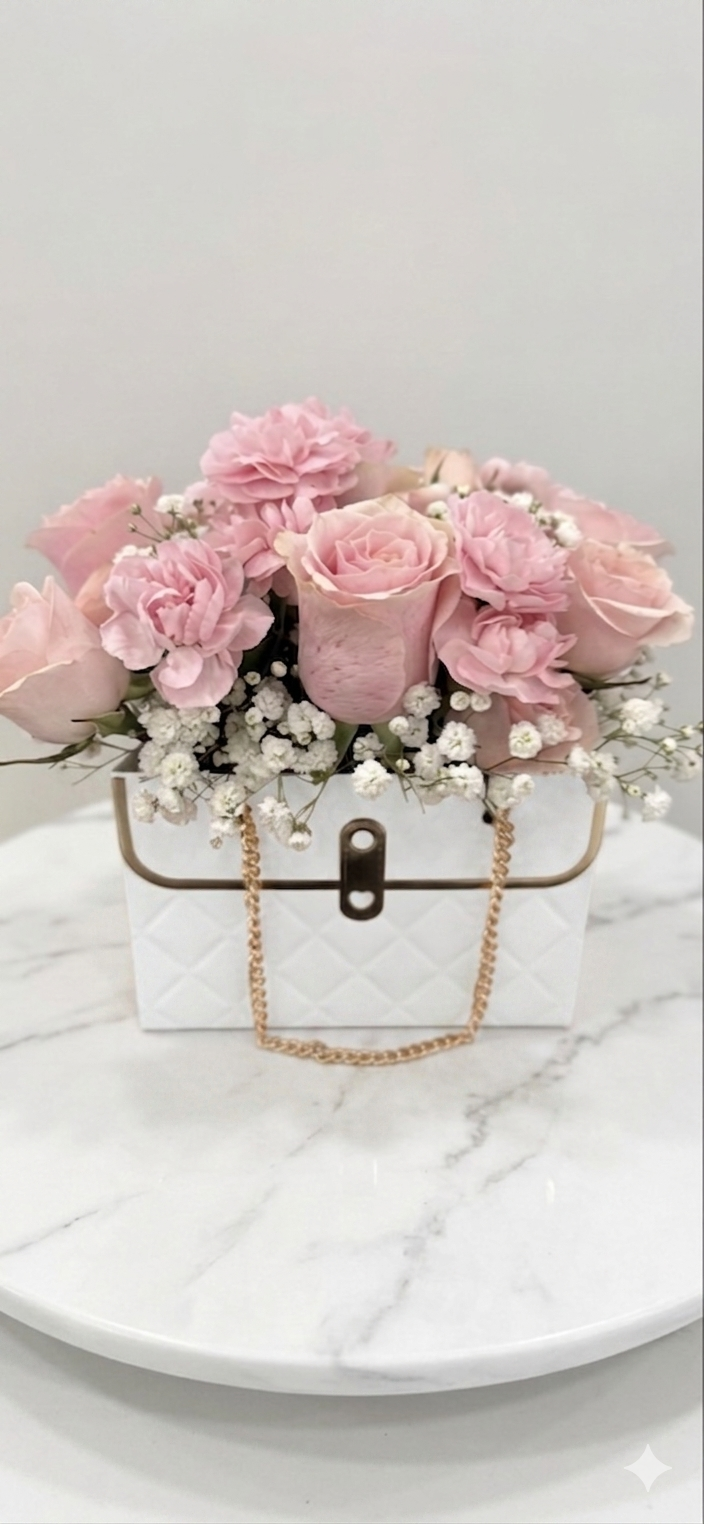 blush-pink-rose-carnation-babys-breath-white-quilted-handbag-bag-arrangement.png