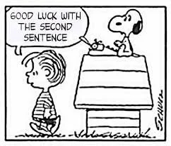 Peanuts comic strip featuring Snoopy sitting on a doghouse with Woodstock, who is holding a sign that says 'Good luck with the second sentence.'