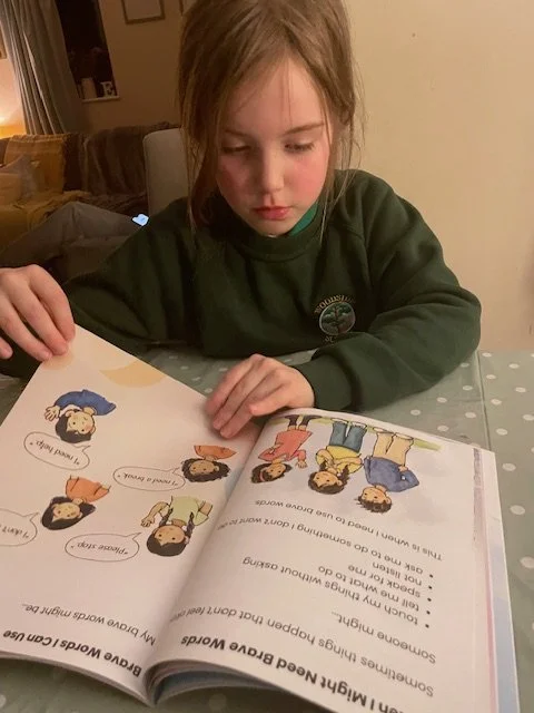 autistic girl reading resource affirming book