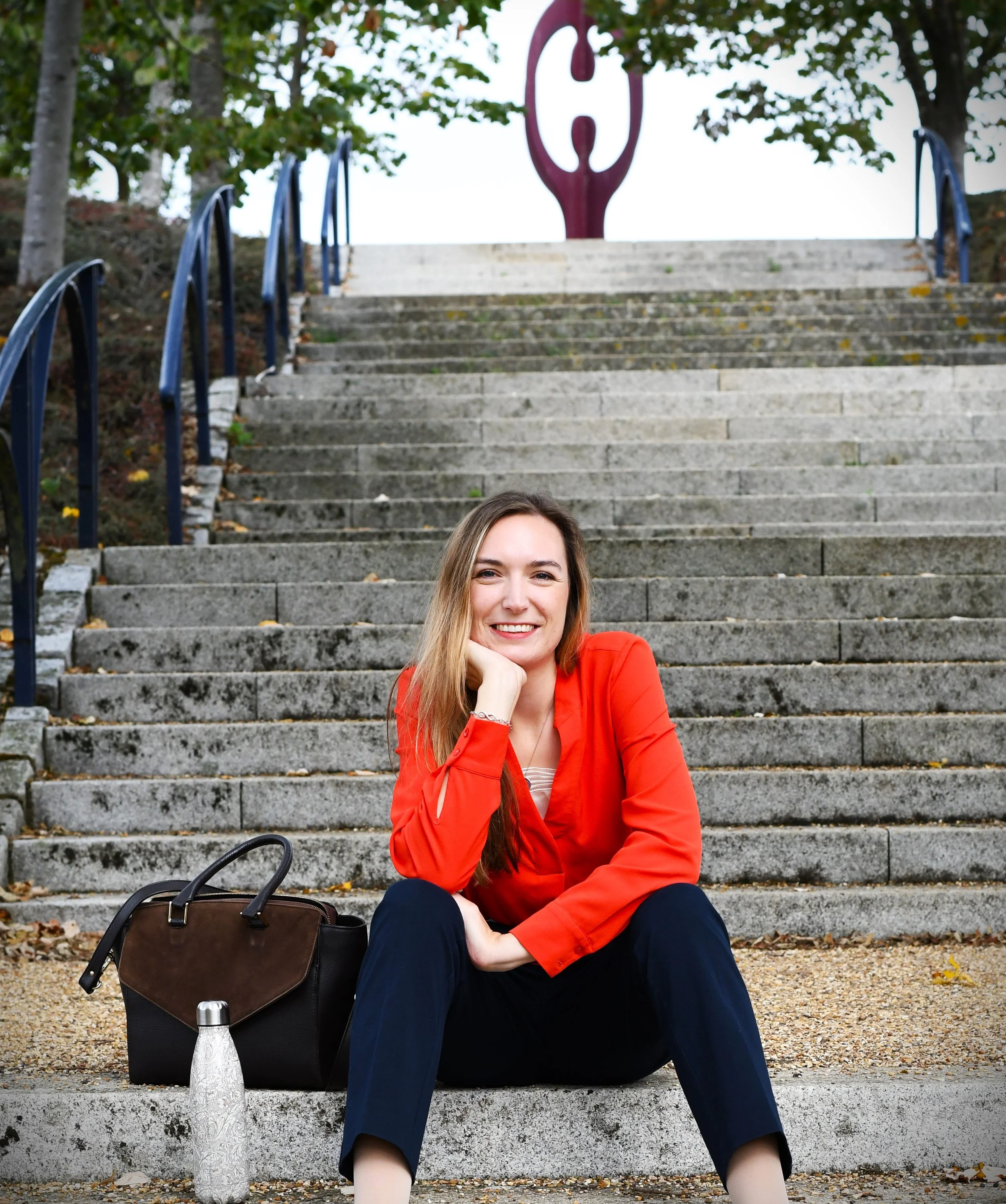 Tamzin sitting on steps in Campbell Park