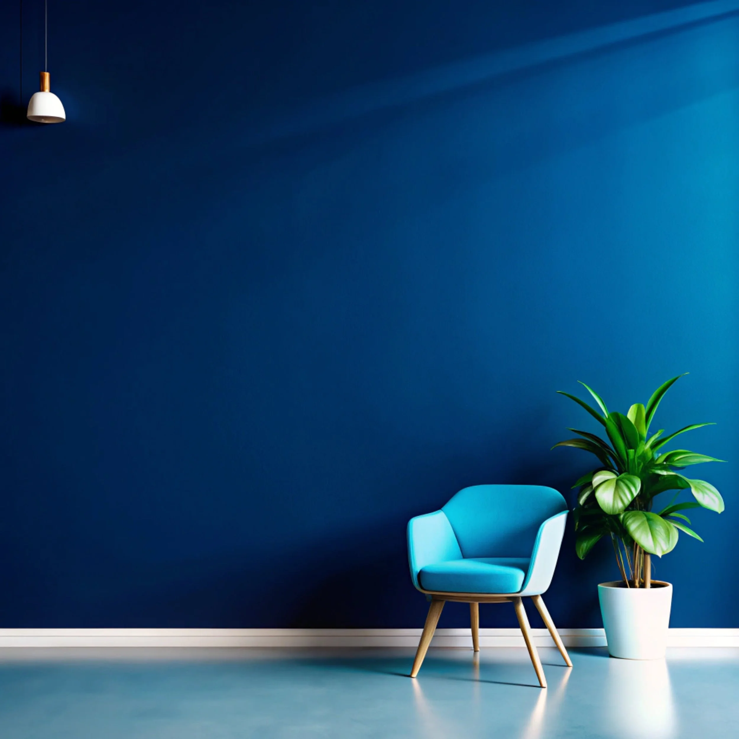 A modern interior with a bright blue armchair and a large green plant in a white pot against a dark blue wall, with a white pendant light hanging from the ceiling.