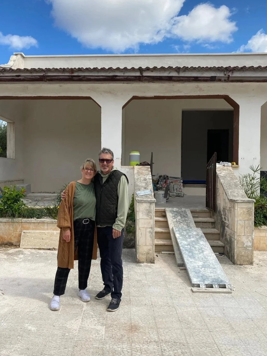 Jan in front of her unfinished house