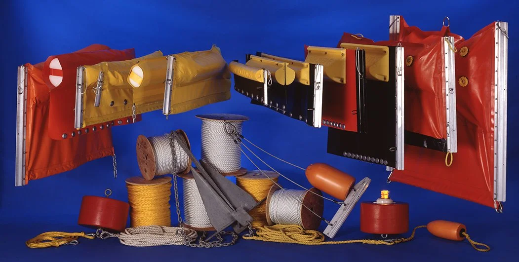 Oil containment booms and associated gear including water rescue bags, ropes, and inflatable buoyancy aids.
