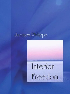 Cover of a book titled "Interior Freedom" by Jacques Philippe with a blue and pink gradient background.
