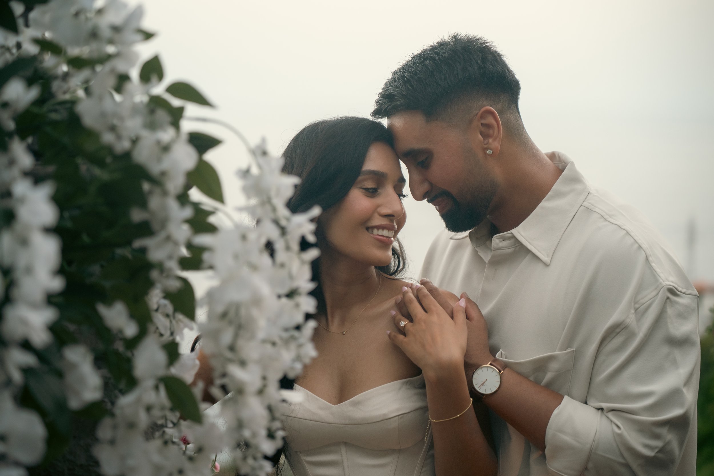 happily engaged couple at the cliffside orchard in madeira photo shoot