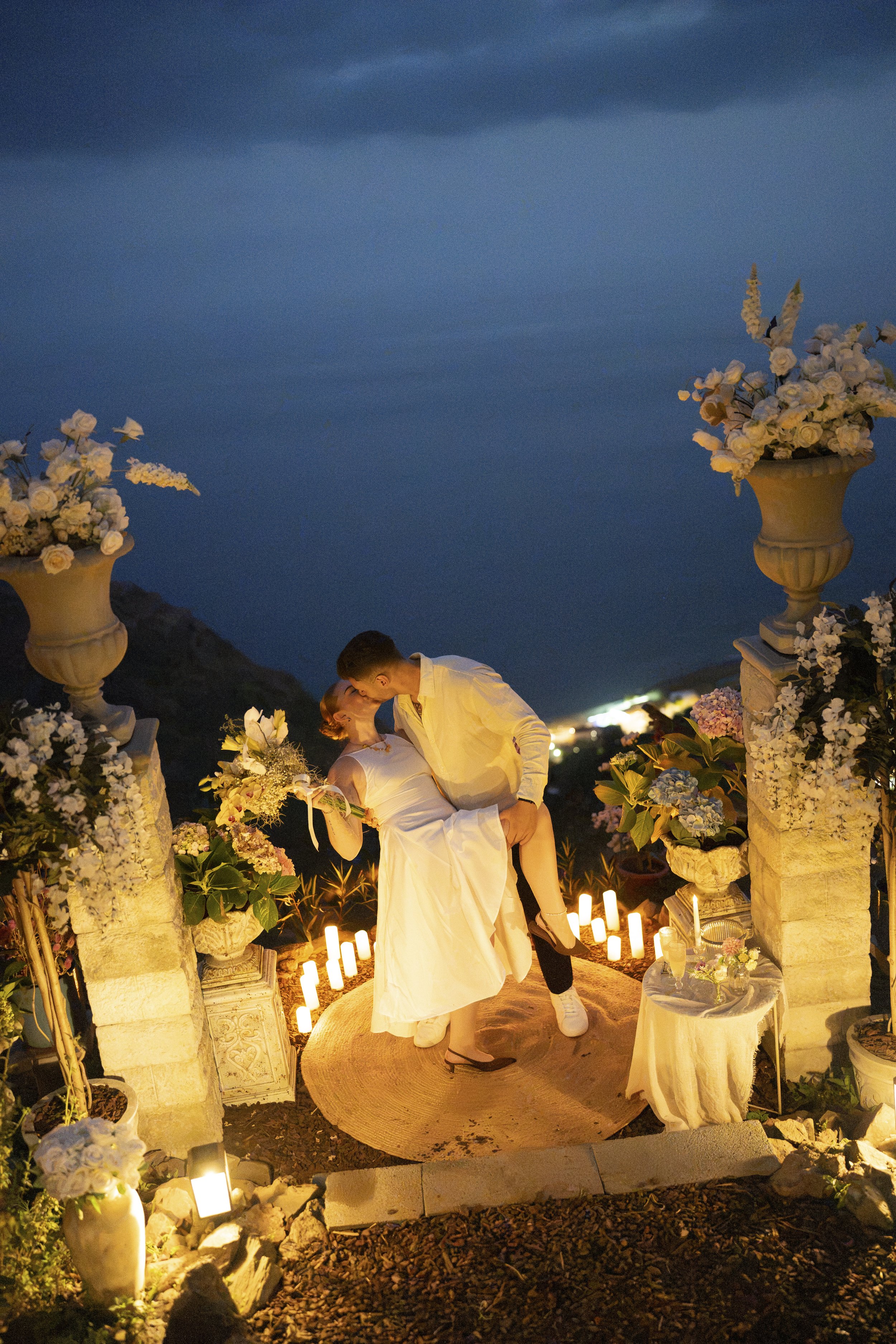 iconic proposal photography shoot at the cliffside orchard after sunset with candle lights