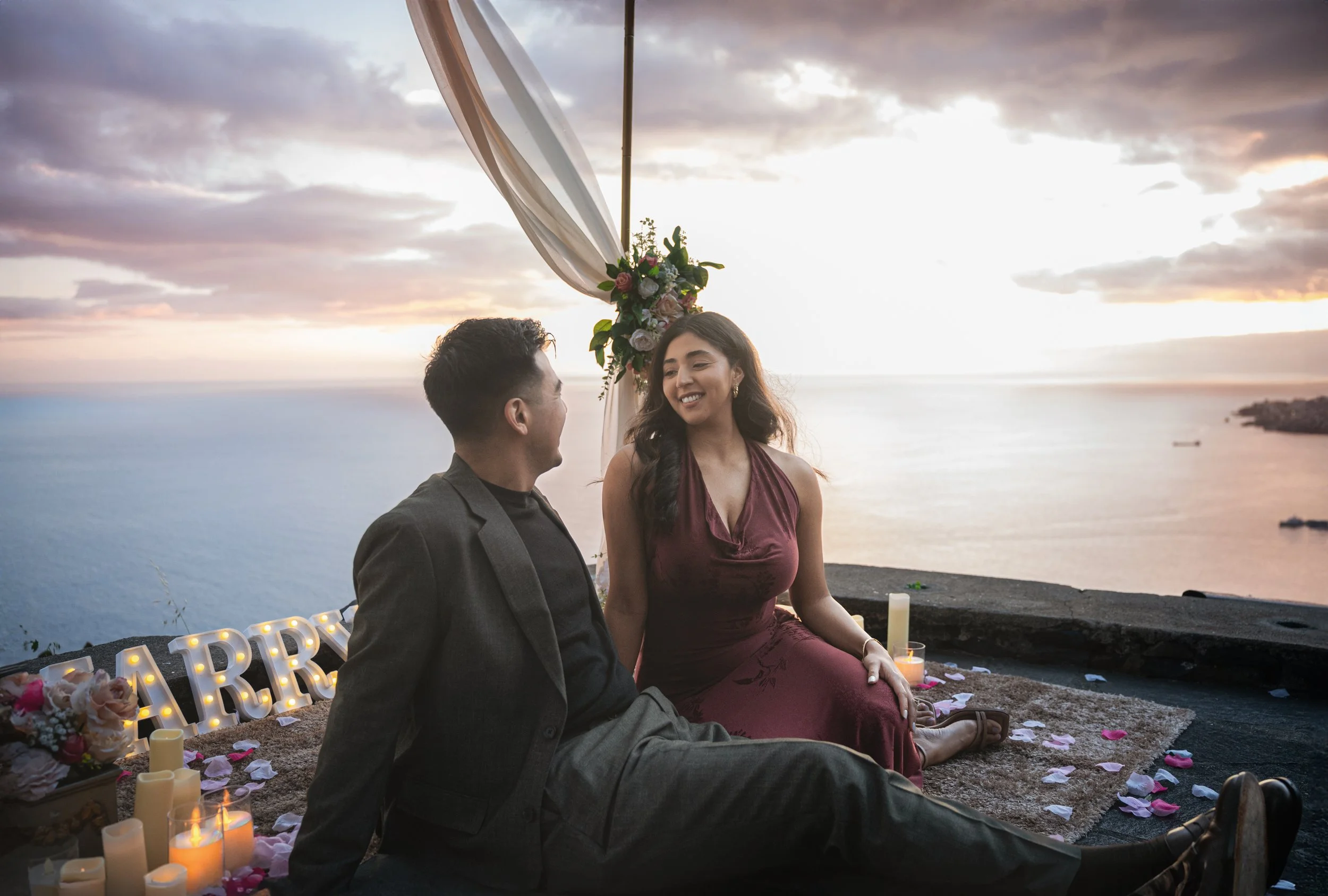 happy couple dream proposal in madeira with romantic setup at sunset
