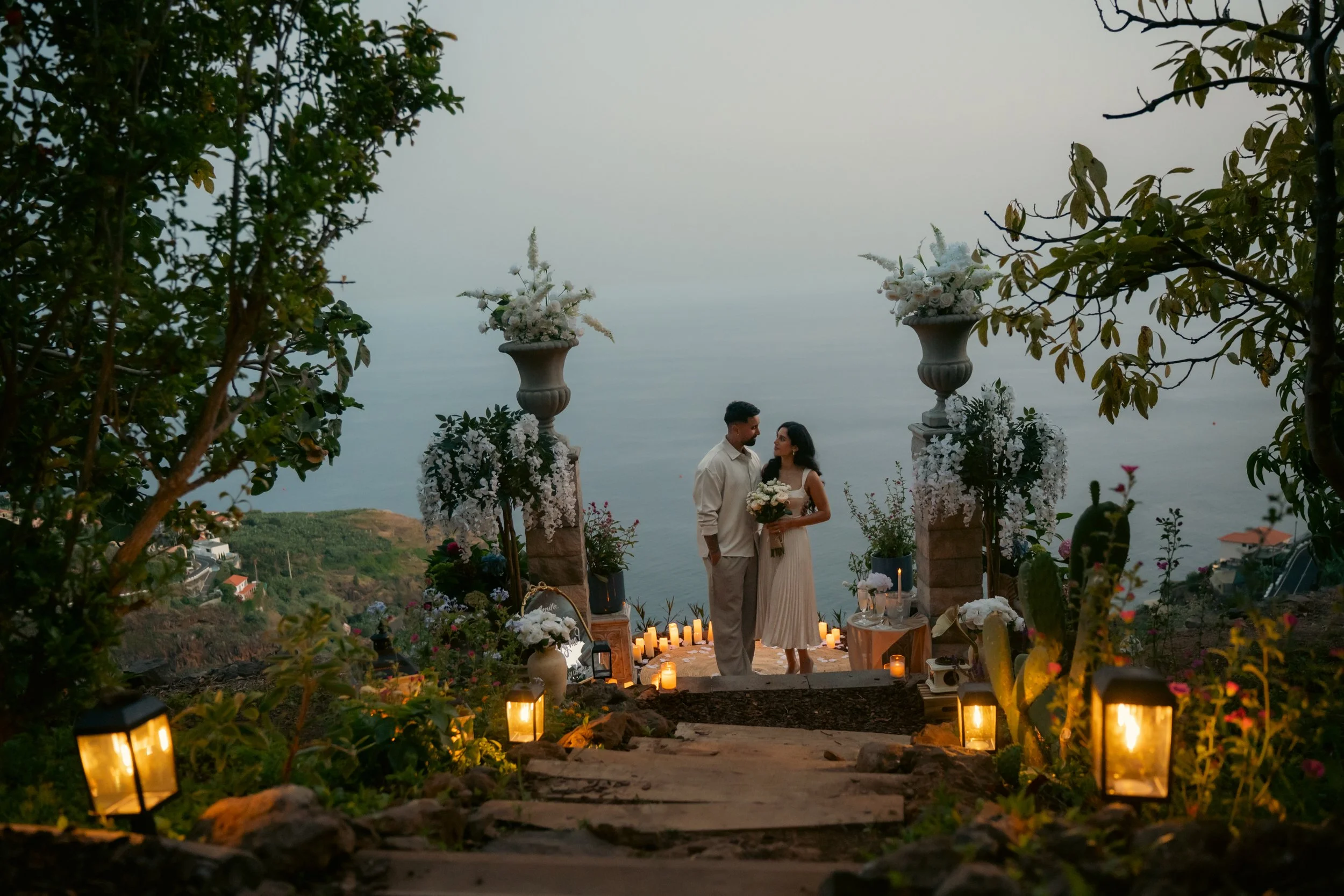 madeira dream proposal at the cliffside orchard at dusk when the secret garden lights up